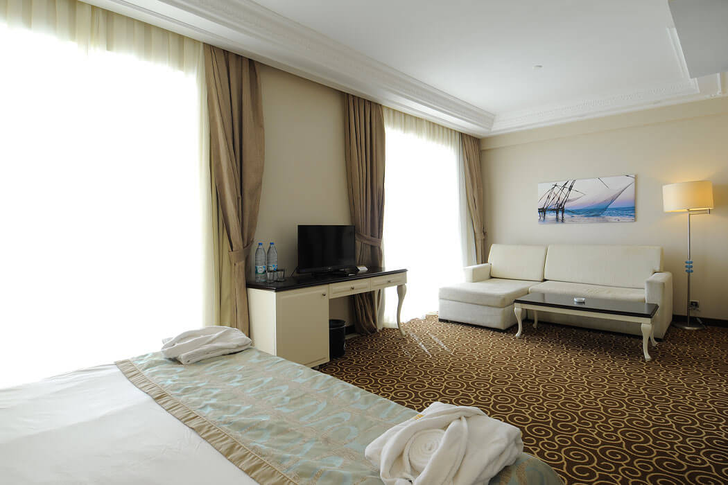 Goldcity Hotel - łóżka w pokoju suite